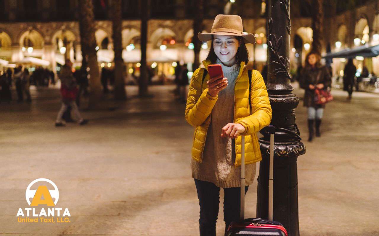 Person looking at a phone screen, researching a private transportation company.